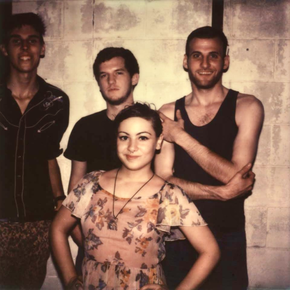 Archival portrait of the four members of Dead Surf