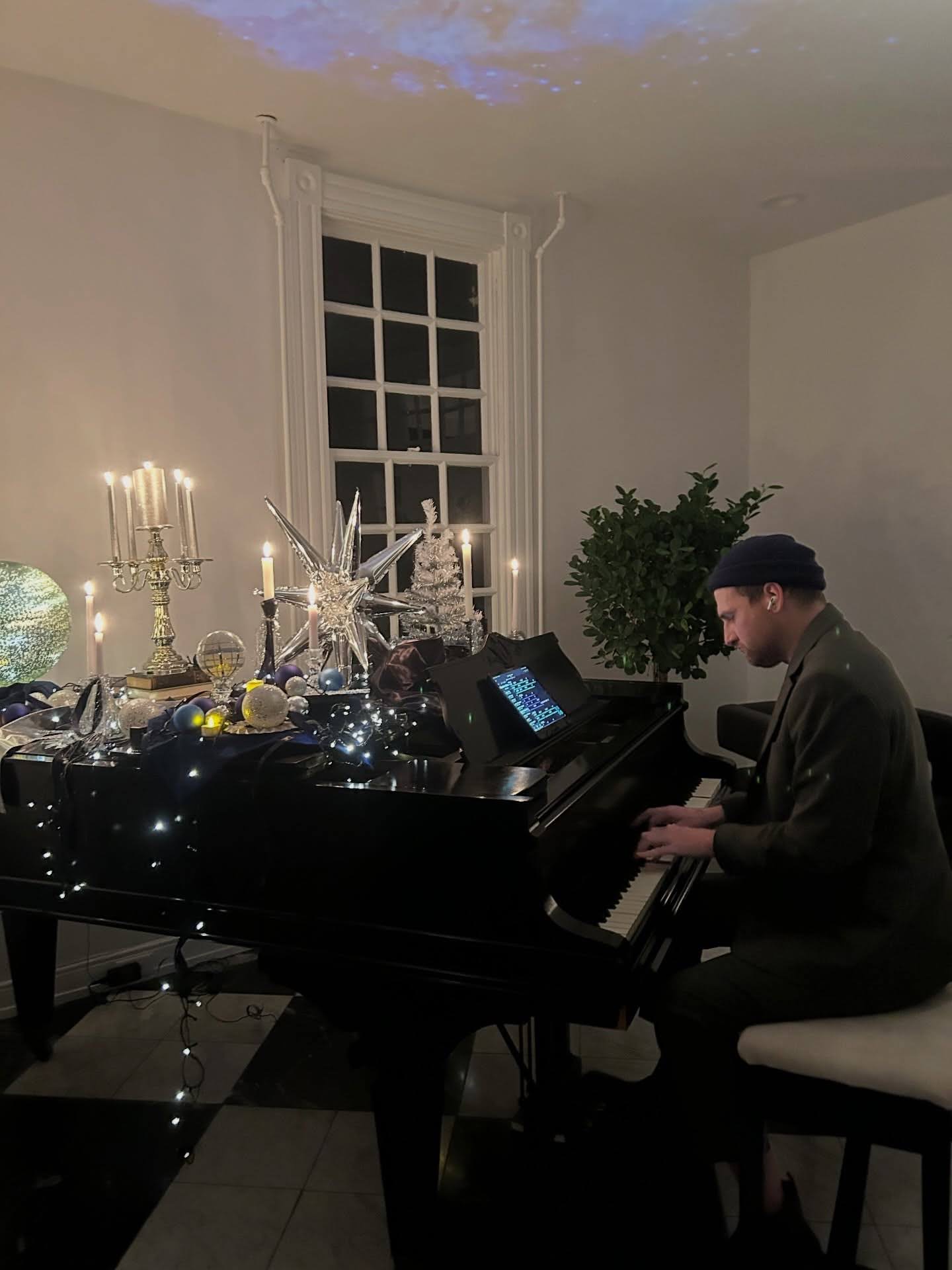 Randy Bryan Moore performing piano during the holiday season