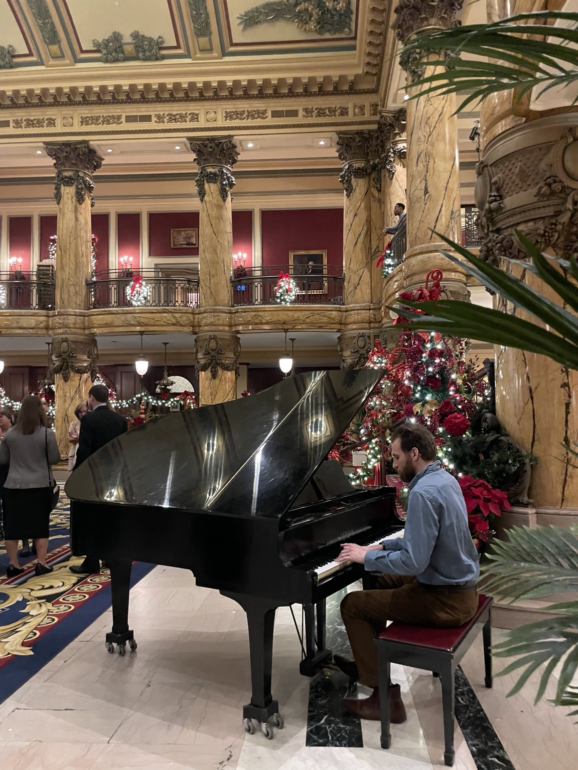 Randy Bryan Moore performing at a grand piano inside The Jefferson Hotel